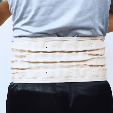 Gold-colored back brace being worn